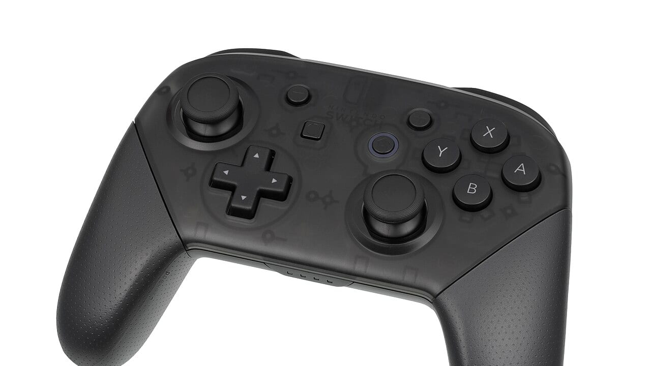 A black video game controller held in two hands
